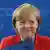 a smiling Chancellor Merkel