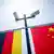Камеры видеонаблюдения на мачте с флагами Германии и Китая