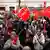 Sanchez supporters pictured with Socialist Party flags at party headquarters in Madrid